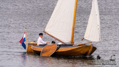 A Dutch Tjotter - replete with beguiling lines and large leeboards - sails in Tasmania at the Australian Wooden Boat Festival.